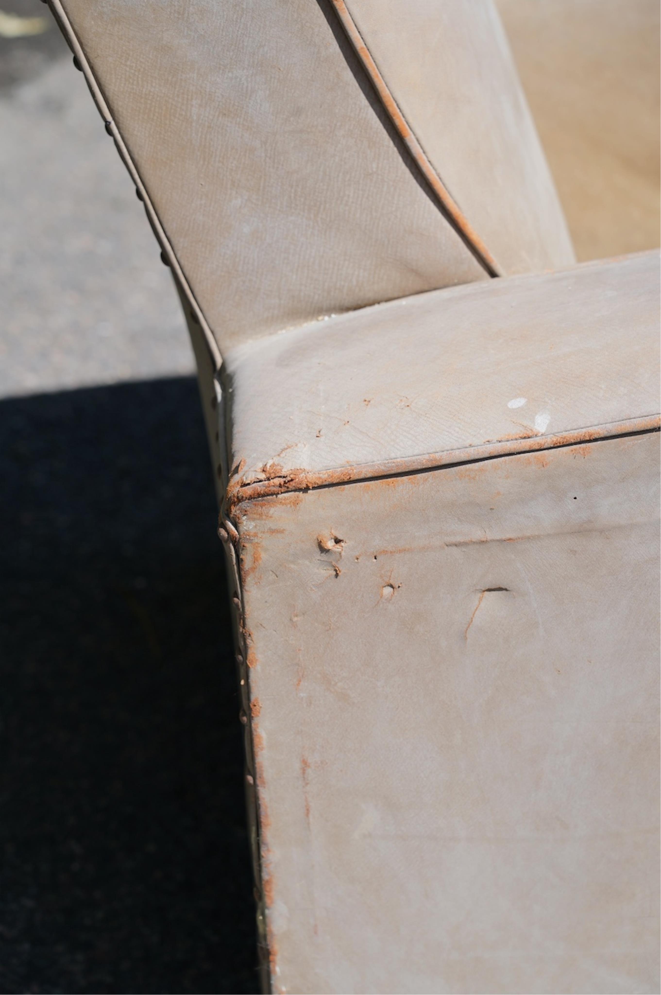 A pair of leather club armchairs, width 85cm, depth 88cm, height 84cm. Condition - poor